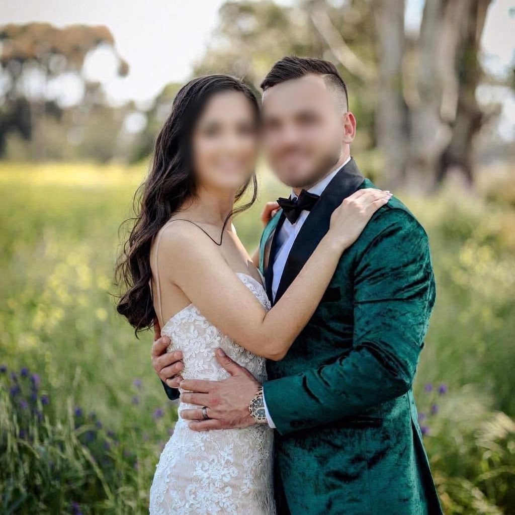 Bride in a custom lace wedding dress with groom in a green velvet tuxedo made by Jet Smart Tailor