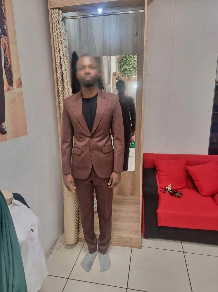 Client wearing a bespoke brown two-piece suit handcrafted in Cape Town by Jet Smart Tailor